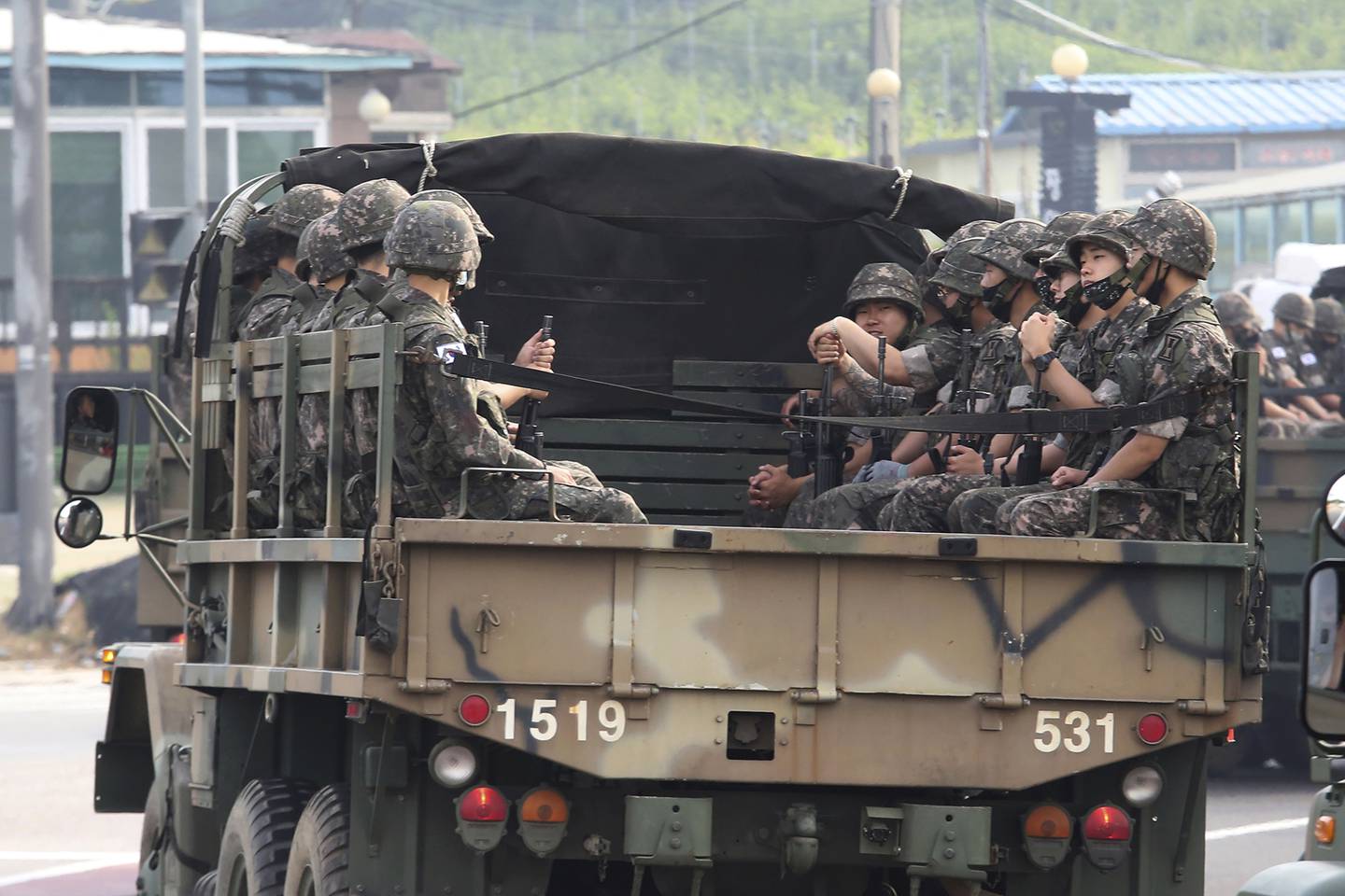 South Korean army soldiers ride on the back of a truck in Paju, near the border with North Korea, South Korea, Wednesday, June 17, 2020.