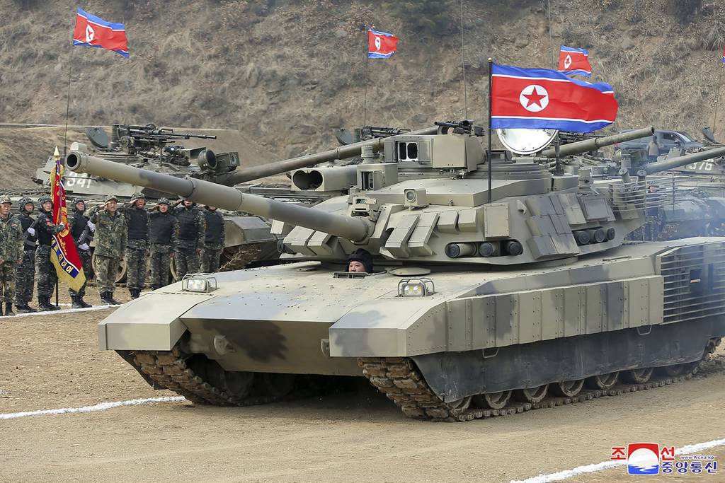 North Korea's Kim test drives new tank