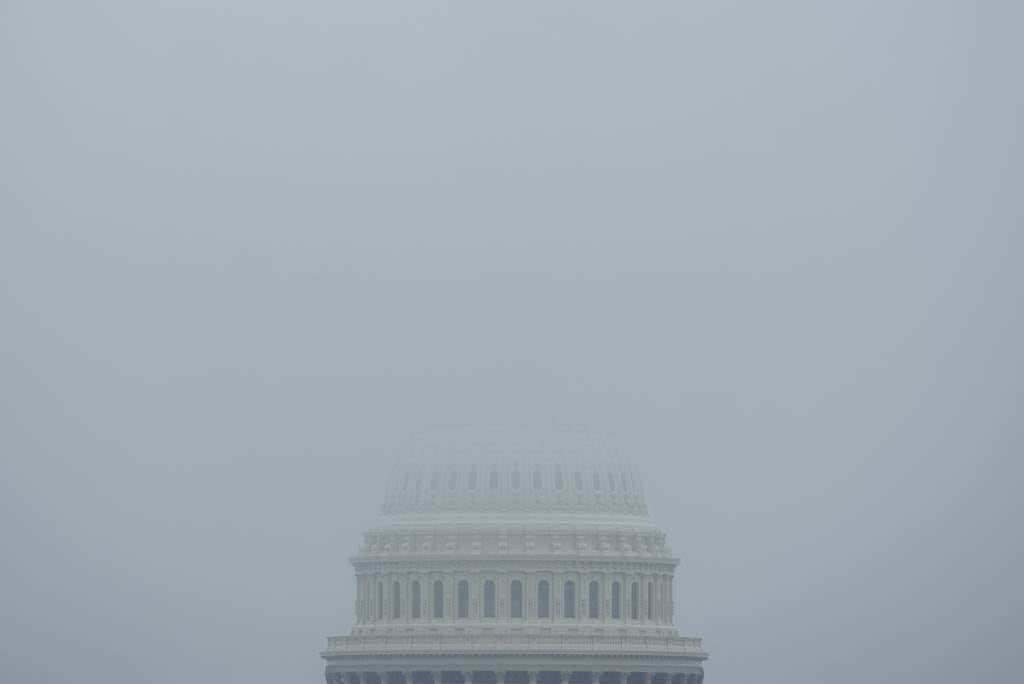 The top of the Capitol Dome in Washington, D.C., is obscured by fog Dec. 3, 2023.