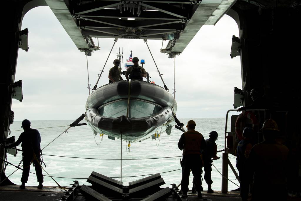 Sailors aboard the Independence-class littoral combat ship USS Gabrielle Giffords (LCS 10) lower a rigid-hulled inflatable boat in preparation for small boat operations Oct. 7, 2020, in the Pacific Ocean.