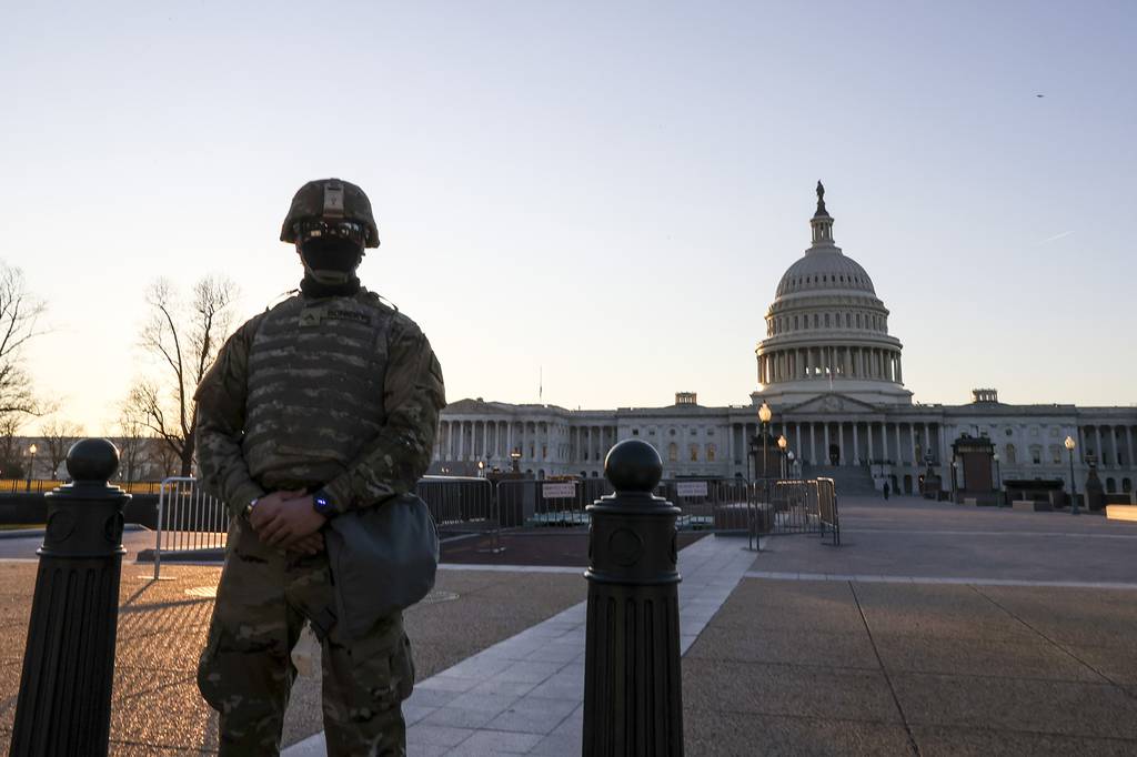 National Guard troops stand guard at the U.S. Capitol on Jan. 12, 2021, in Washington.