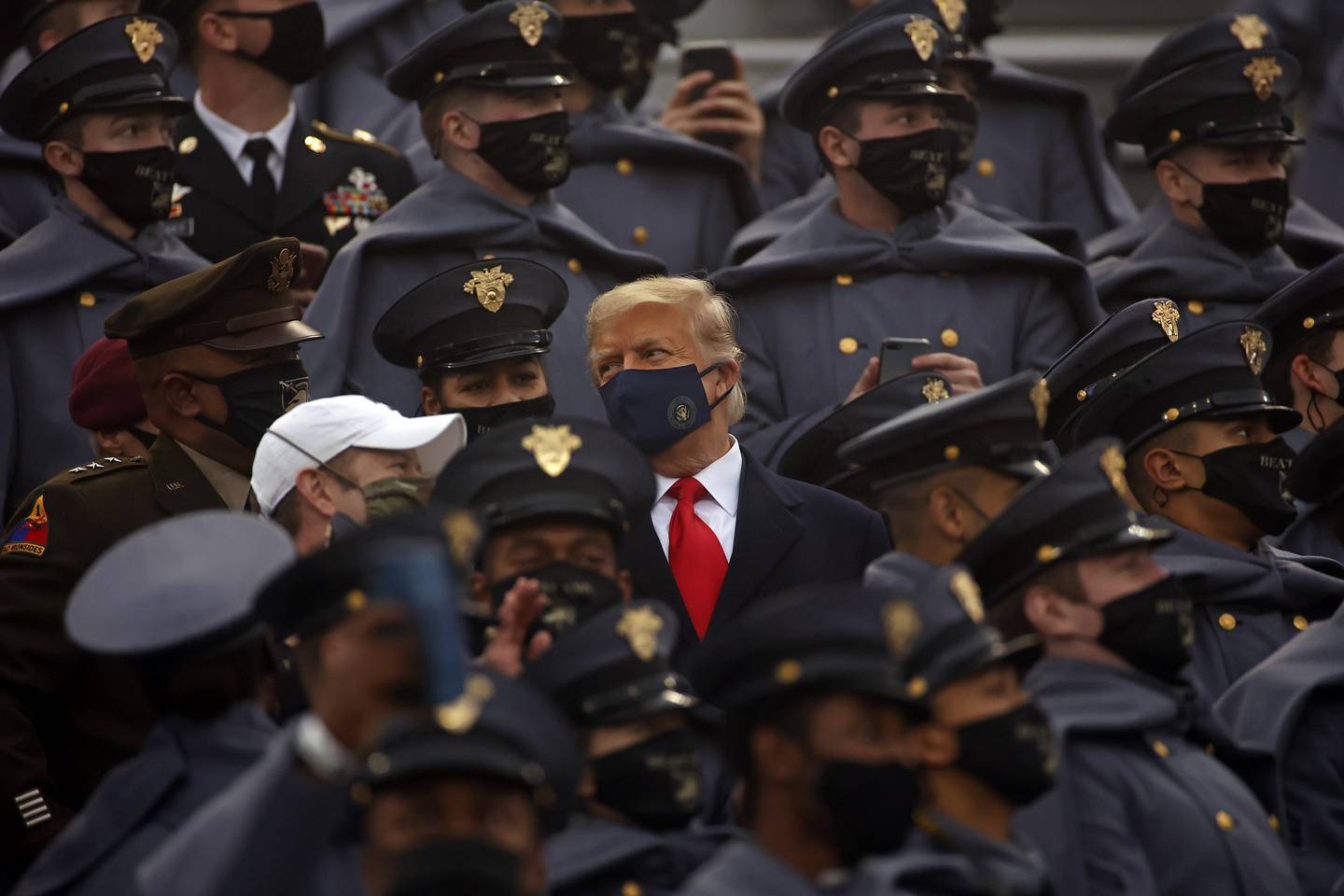 President Donald Trump watches an NCAA college football game with Army cadets during the Army-Navy NCAA college football game on Saturday, Dec. 12, 2020, in West Point, N.Y.