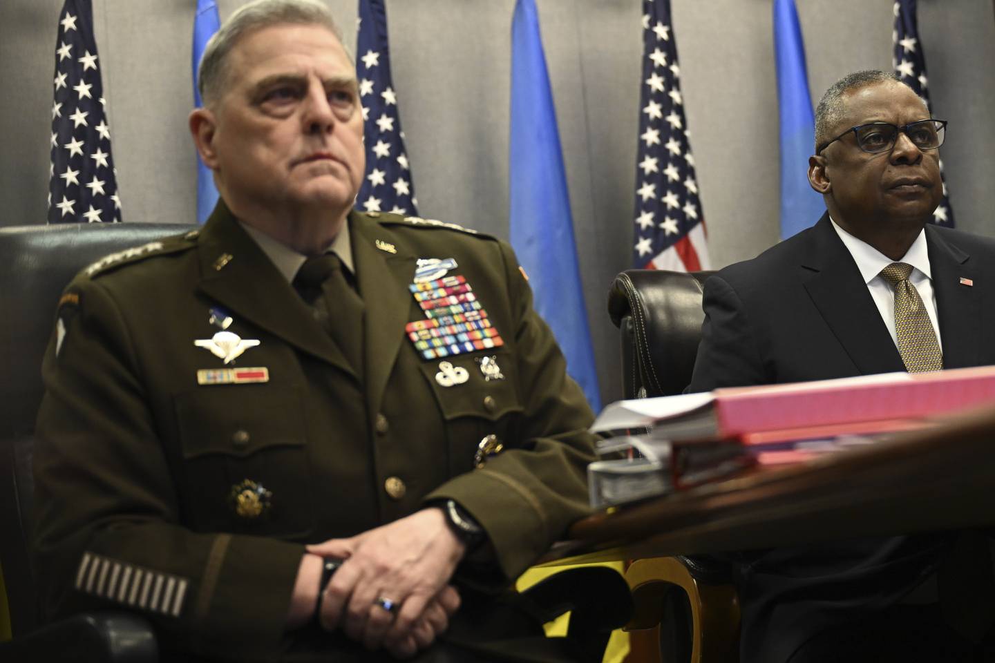 Defense Secretary Lloyd Austin, right, and Chairman of the Joint Chiefs of Staff Gen. Mark Milley, attend a virtual meeting of the Ukraine Defense Contact Group, Wednesday, March 15, 2023, at the Pentagon in Washington.