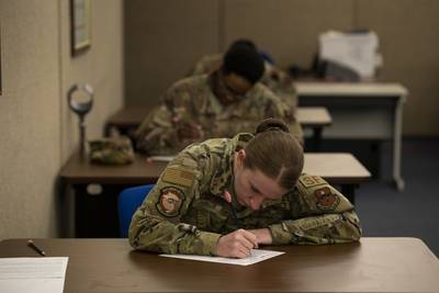 U.S. Air Force Senior Airman Jewel Favreau, assigned to the 97th Security Forces Squadron, fills out a promotion testing form on May 20, 2020 at Altus Air Force Base, Oklahoma. (Tech. Sgt. Kenneth W. Norman/Air Force)