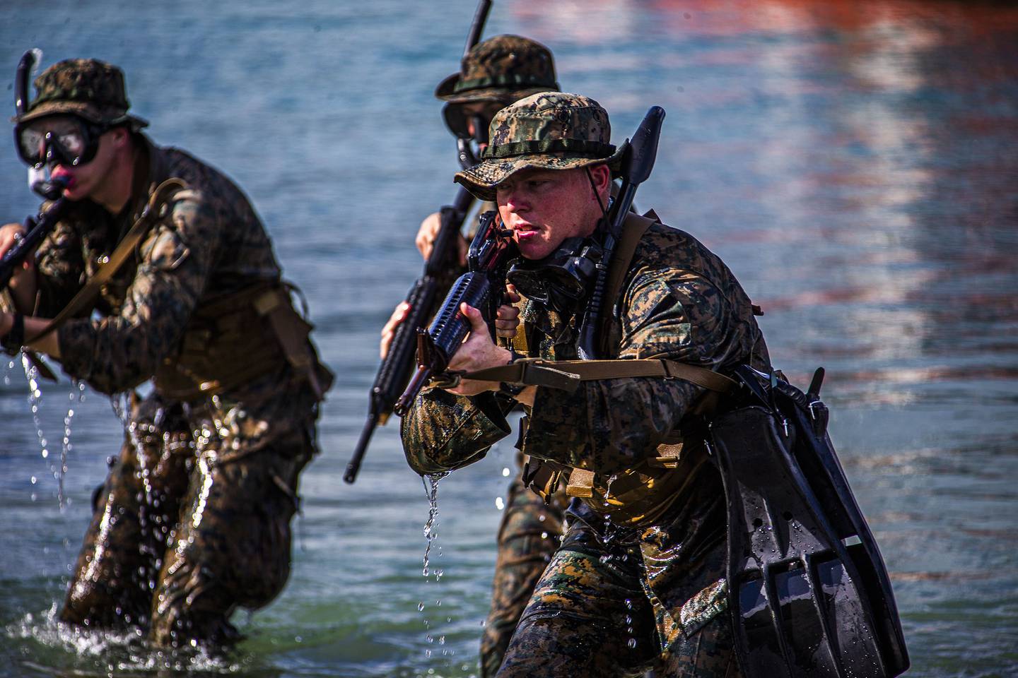 Marines hit the shore during an amphibious assault exercise on Marine Corps Base Hawaii, April 28, 2020.
