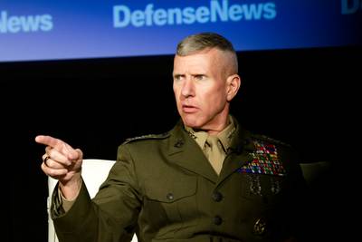 Gen. Eric Smith, the assistant commandant for the Marine Corps, points toward the audience at the Defense News Conference on Sept. 7, 2022.