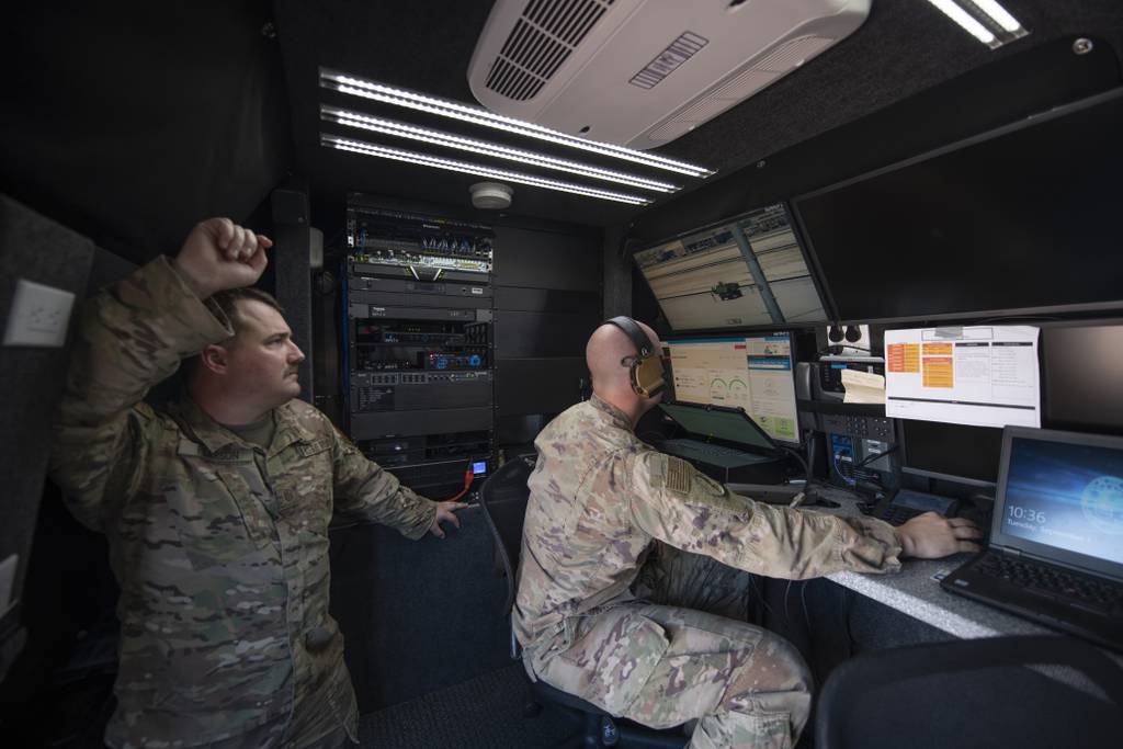 Master Sgt. Kyle Pearson and Tech. Sgt. Kevin Koenig are pictured at a simulated austere base during an Advanced Battle Management System exercise on Nellis Air Force Base, Nevada, in September 2020.