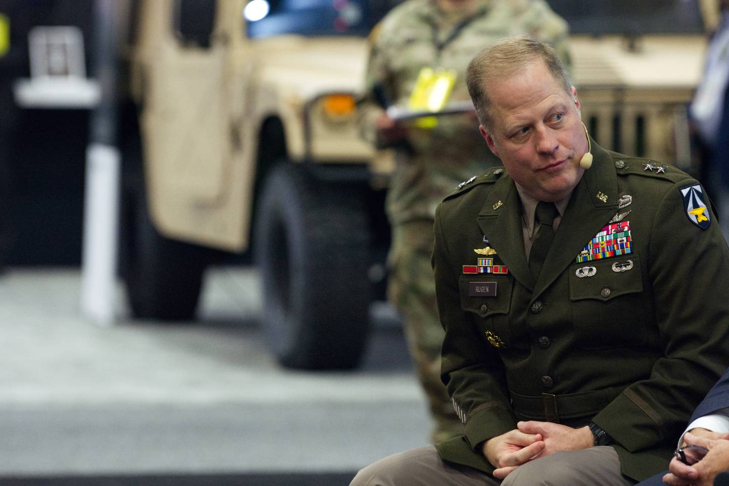 Maj. Gen. Walter Rugen, the director of the Future Vertical Lift Cross-Functional Team, listens to a speech Oct. 12, 2022, at the Association of the U.S. Army annual conference in Washington, D.C.