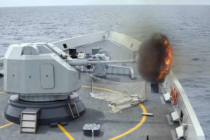 In this file photo released by China's Xinhua News Agency, an anti-surface gunnery is fired from China's Navy missile frigate Yulin during the "Exercise Maritime Cooperation 2015" by Singapore and Chinese navies in the South China Sea on May 24, 2015.