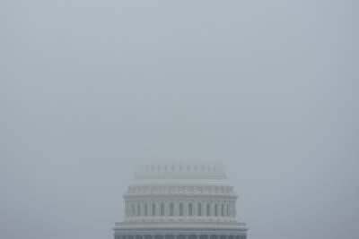 The top of the Capitol Dome in Washington, D.C., is obscured by fog Dec. 3, 2023.