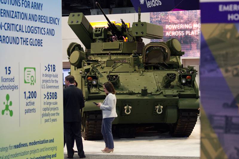An Armored Multi-Purpose Vehicle with mounted counter-drone weaponry is seen at the BAE Systems booth at the 2023 Association of the U.S. Army convention in Washington, D.C.