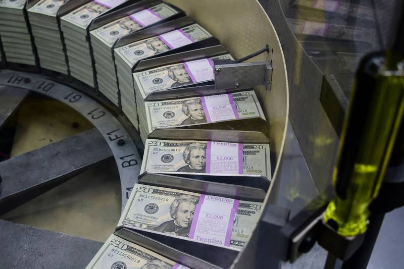 Packs of freshly printed $20 bills are processed for bundling and packaging at the U.S. Treasury's Bureau of Engraving and Printing in Washington on July 20, 2018.