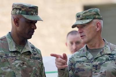 U.S. Army Brig. Gen. Jeth Rey and Maj. Gen. Anthony Potts converse on the sidelines of an event in Delaware on Aug. 9, 2022.