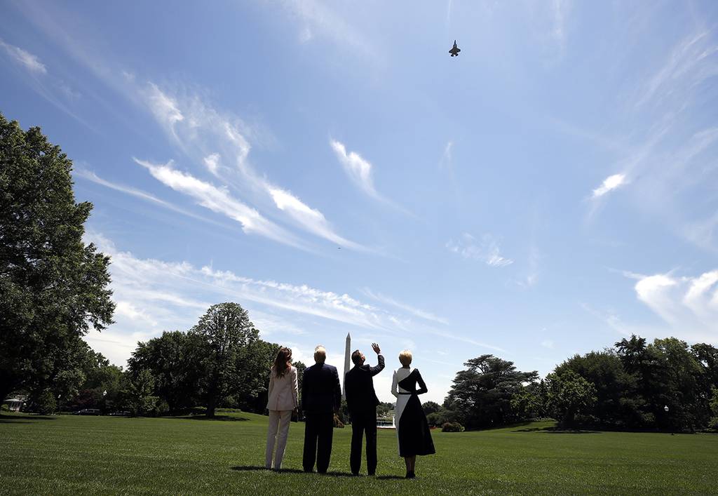 President Donald Trump, first lady Melania Trump, Polish President Andrzej Duda, and his wife Agata Kornhauser-Duda watch a flyover of a F-35 Lightning II jet at the White House, Wednesday, June 12, 2019, in Washington.