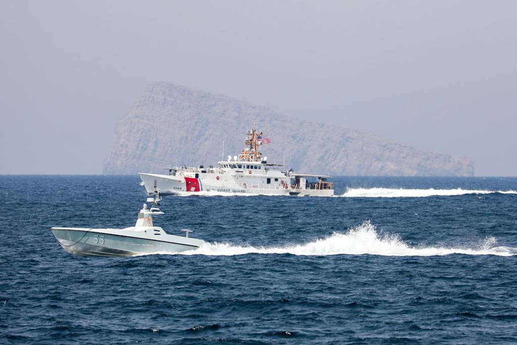 The USCGC John Scheuerman moves through the Strait of Hormuz alongside an L3Harris Arabian Fox MAST-13 unmanned surface vessel on April 19, 2023.