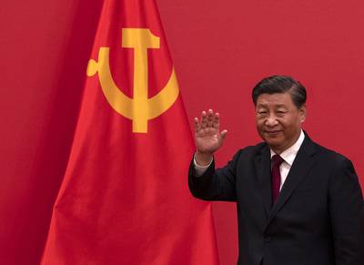 Chinese President Xi Jinping waves as he leaves after speaking at a press event at The Great Hall of People on Oct. 23, 2022, in Beijing, China.
