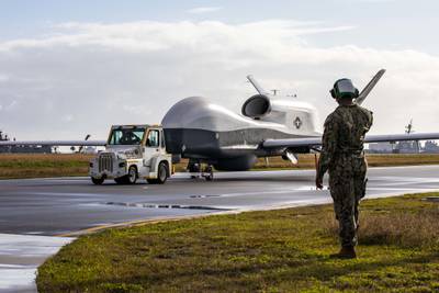 An MQ-4C Triton unmanned aircraft system taxis across the flight line at Naval Station Mayport, Florida, on Dec. 16, 2021.