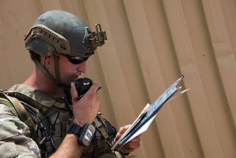 U.S. Air Force Staff Sgt. Robert Cooch delivers attack coordinates to B-52 bomber pilots during Exercise Dragon Strike in June 2015 at Avon Park Air Force Range, Florida.