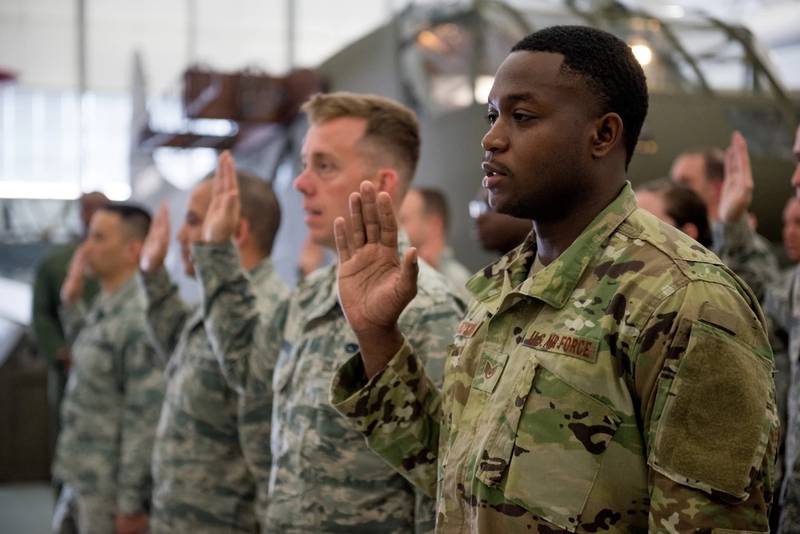 Airmen from the 512th Airlift Wing raise their right hands during a non-commissioned officer induction ceremony held at the Air Mobility Command Museum in Dover, Delaware, May 19, 2019. (Capt. Katie Spencer/Air Force)