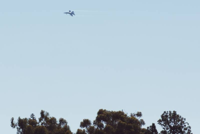 A jet is seen flying near the San Diego Convention Center on Feb. 15, 2024, during the final day of the West naval conference.