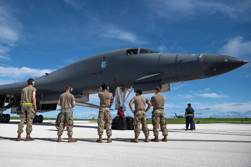 Airmen assigned to the 28th Bomb Wing recieve a U.S. Air Force B-1B Lancer assigned to the 37th Expeditionary Bomb Squadron, Ellsworth Air Force Base, South Dakota, after landing at Andersen Air Force Base, Guam, in support of a Bomber Task Force mission, Oct. 18, 2022. Bomber missions contribute to joint force lethality and deter aggression in the Indo-Pacific by demonstrating the U.S. Air Force’s ability to operate anywhere in the world at any time in support of the National Defense Strategy. (Senior Airman Yosselin Campos/Air Force)