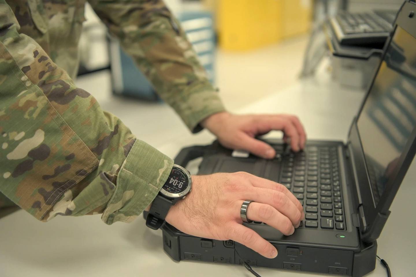 An airman from the 18th Component Maintenance Squadron wears gear for the Rapid Analysis of Threat Exposure study while working at Kadena Air Base, Japan, April 29, 2021. The RATE study acts as a check-engine light for participants that can tell them when something with their health is amiss or when their body may be developing an infection. (Senior Airman Demond McGhee/Air Force)