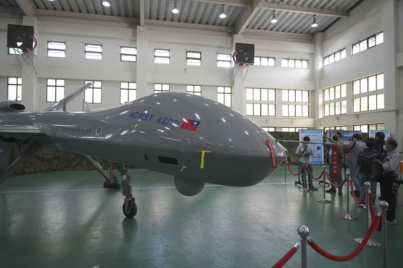 Members of the media look at the Taiwanese developed large UAV Teng Yun, which resembles the American MQ-9 Reaper and can stay aloft for up to 24 hours at the National Chung-Shan Institute of Science and Technology in Taichung in central Taiwan on Tuesday, Nov. 15, 2022.