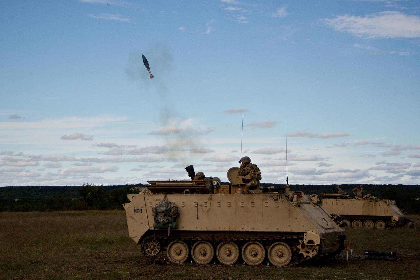 U.S. Army soldiers fire mortars from a cannon mounted on a M113 armored personnel carrier during an exercise Oct. 25, 2018, in the Fort Hood training area.