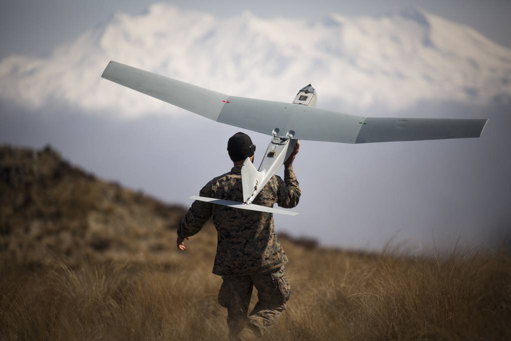 U.S. Marine Corps Sgt. Kevin Ware launches a small unmanned aircraft system as part of exercise Joint Assault Signals Company Black at Waiouru Military Camp, New Zealand, in September 2018.