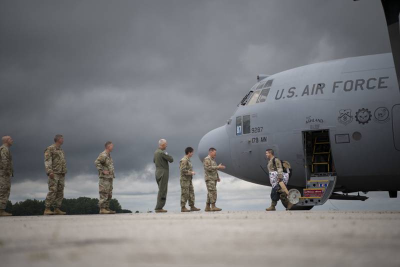The last rotations of airmen from the 179th Airlift Wing, Mansfield, Ohio, return to their home station in a C-130H Hercules, July 9, 2021. The 164th Airlift Squadron and 179th Maintenance Group have completed their missions flying and maintaining the C-130H aircraft in support of Operation Spartan Shield. (Master Sgt. Joe Harwood/Air National Guard)