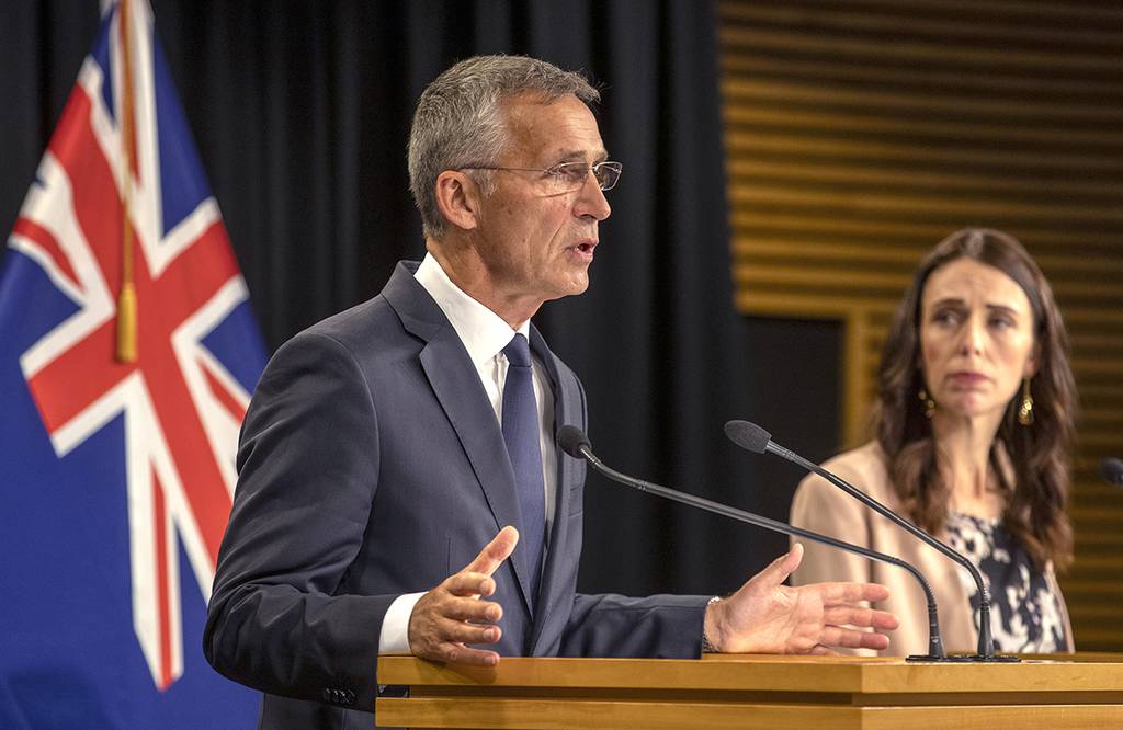 NATO Secretary-General Jens Stoltenberg, left, gestures as he answers questions as New Zealand's Prime Minister Jacinda Ardern watches during a joint press conference at Parliament in Wellington, New Zealand, Tuesday, Aug. 6, 2019.
