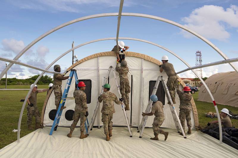 Airmen assigned to the 36th Wing put up tents during an operational readiness exercise at Andersen Air Force Base, Guam, Sept. 12, 2022. (Airman 1st Class Lauren Clevenger/Air Force)